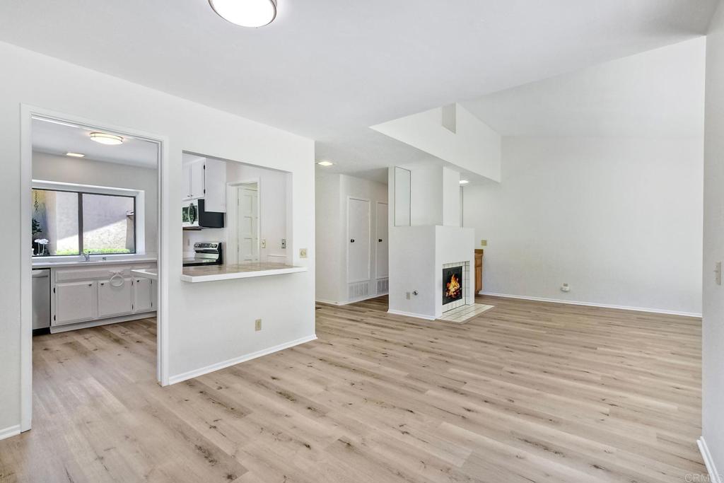 4135 Pinehurst Court Fallbrook, CA 92028 - Photo 11 of 25 a view of a kitchen with refrigerator and white cabinets