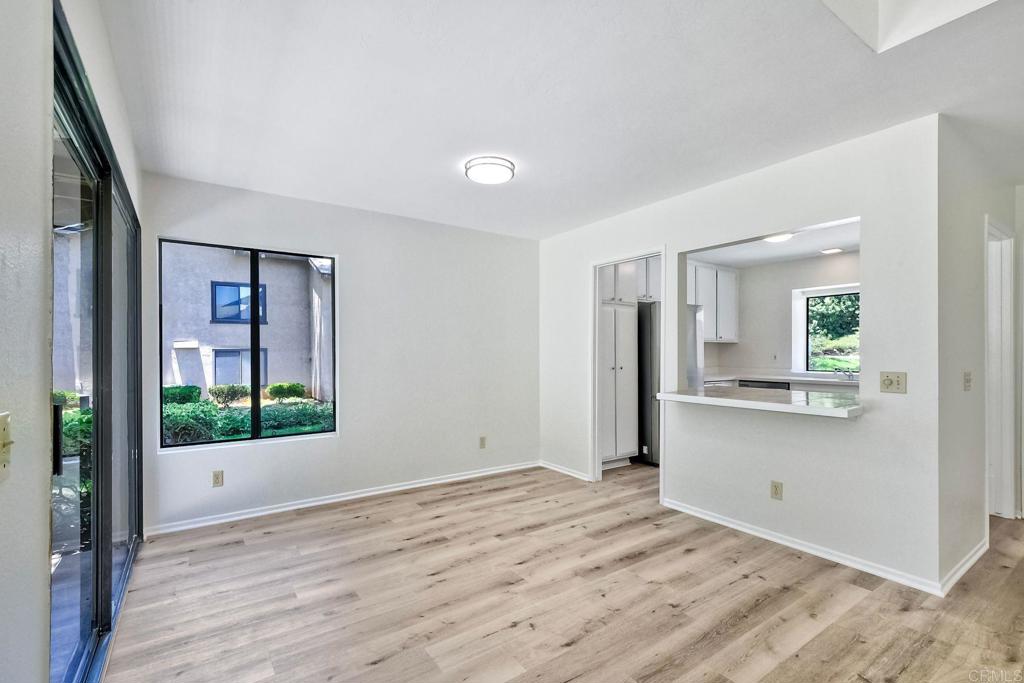 4135 Pinehurst Court Fallbrook, CA 92028 - Photo 10 of 25 a view of a big room with wooden floor and windows