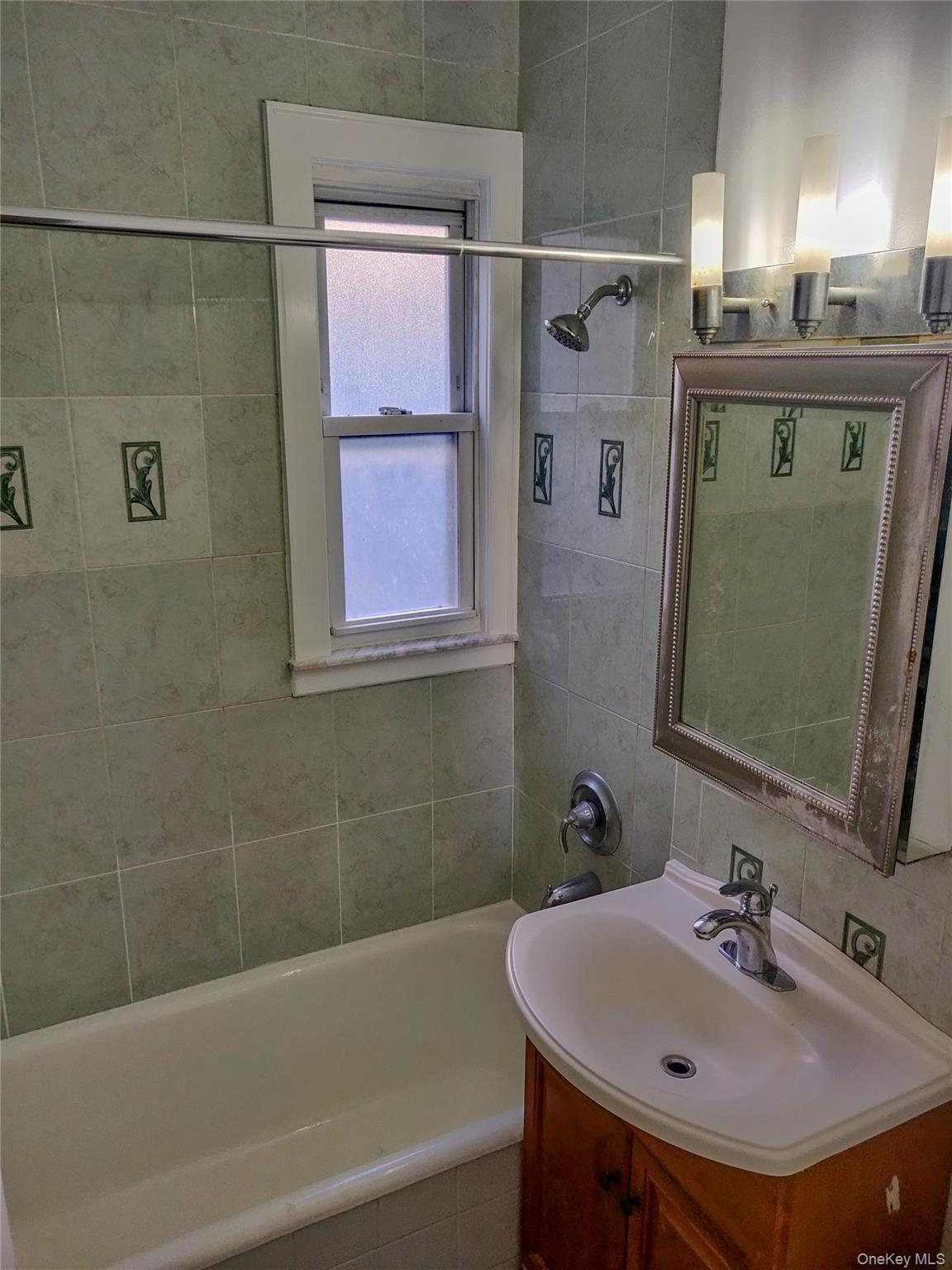 41-43 49th Street Queens, NY 11104 - Photo 2 of 6 a bathroom with a sink and a bathtub