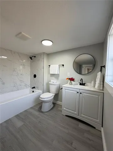 a very nice looking room with a chair and a fireplace