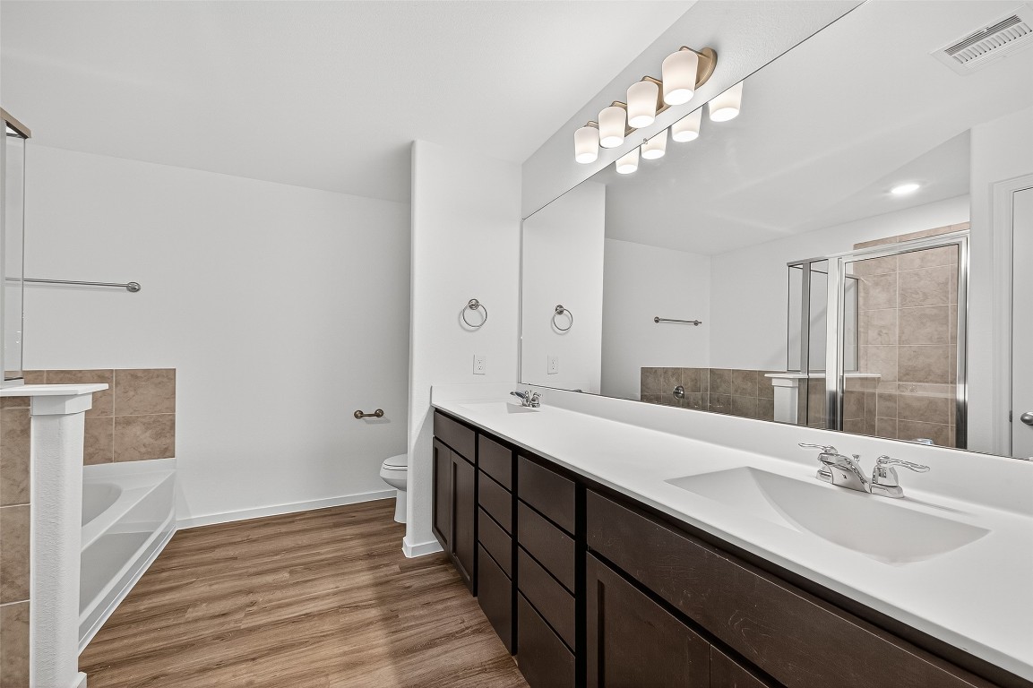 20835 Attalos Stoa Road Crosby, TX 77532 - Photo 31 of 46 a bathroom with a double vanity sink and a mirror