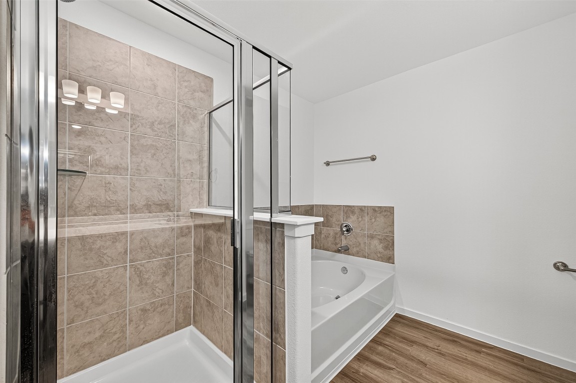 20835 Attalos Stoa Road Crosby, TX 77532 - Photo 32 of 46 a bathroom with a bathtub and a shower