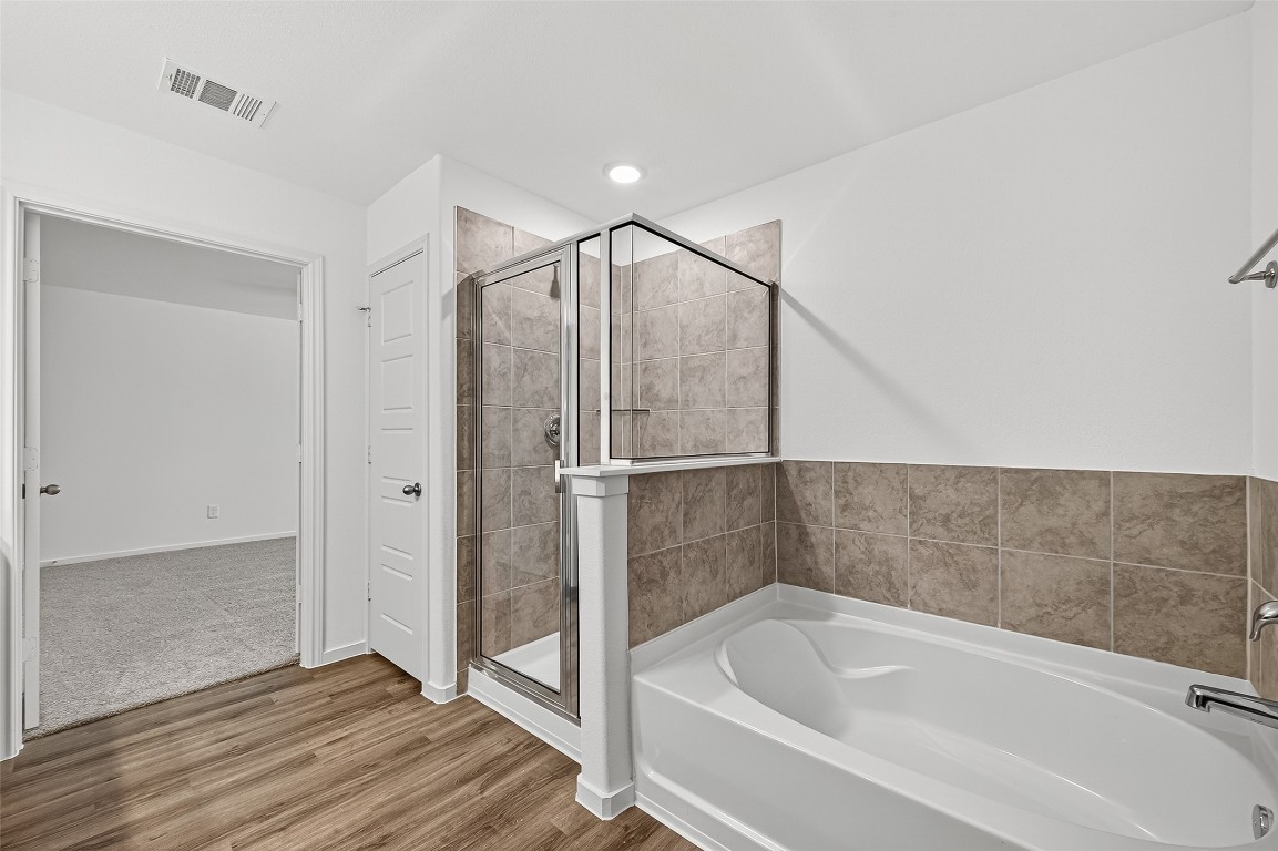 20835 Attalos Stoa Road Crosby, TX 77532 - Photo 33 of 46 a bathroom with a bathtub and a shower