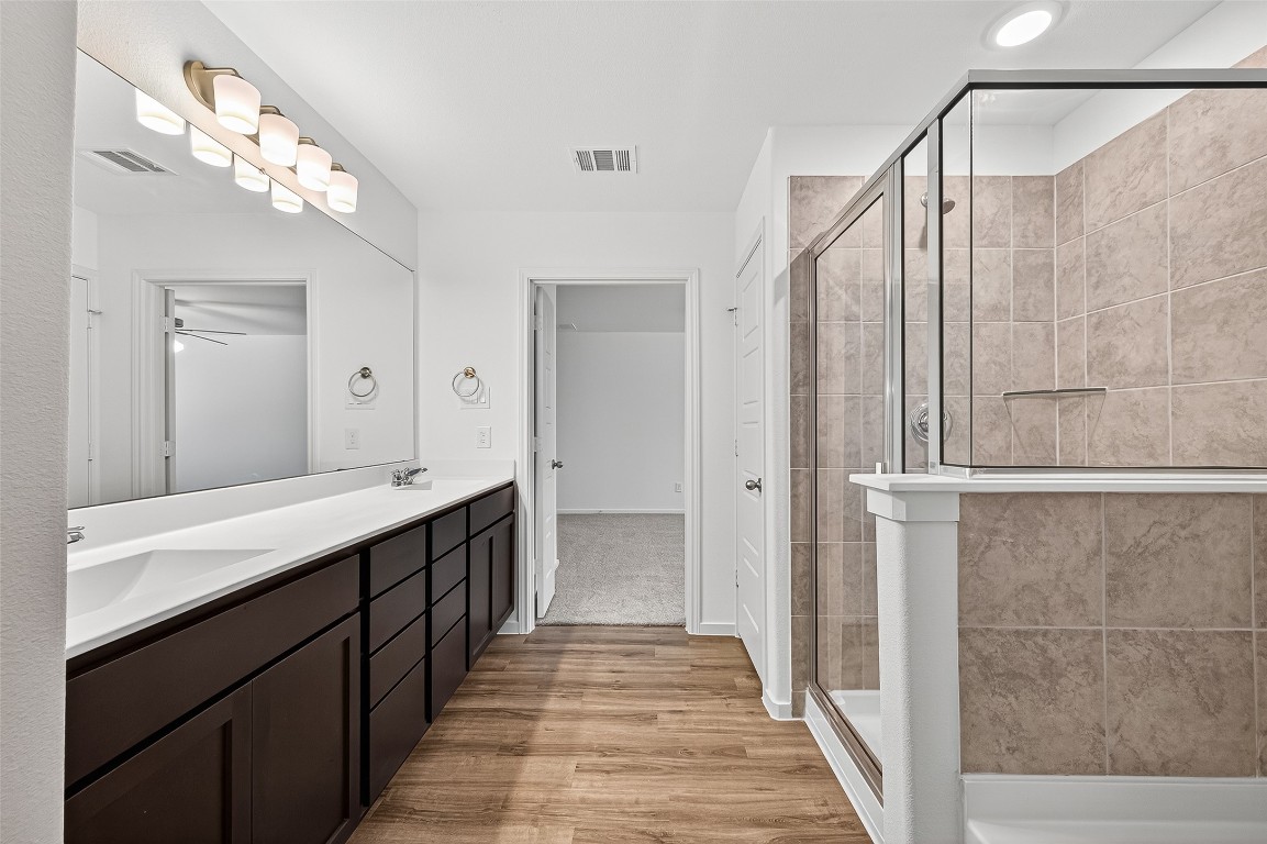 20835 Attalos Stoa Road Crosby, TX 77532 - Photo 34 of 46 a spacious bathroom with a double vanity sink and a mirror