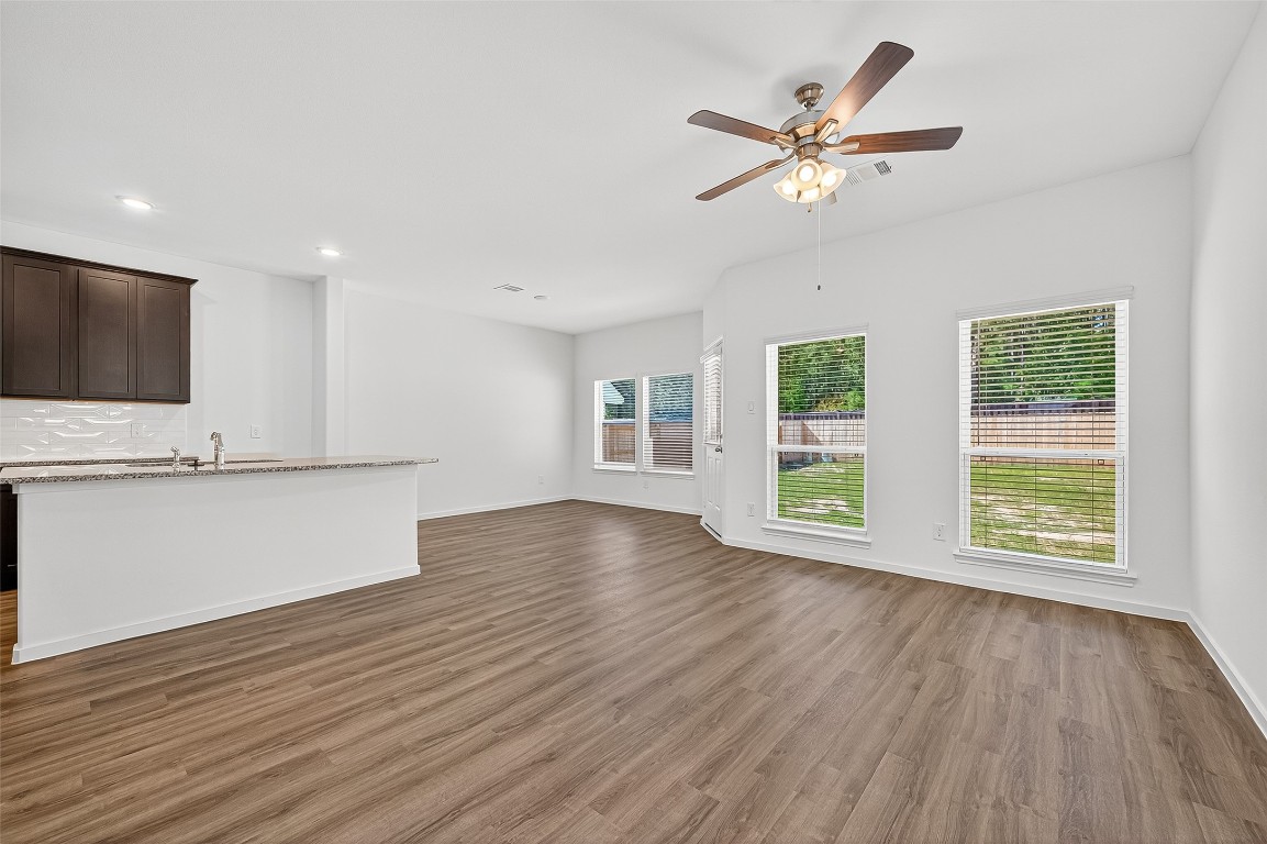 20835 Attalos Stoa Road Crosby, TX 77532 - Photo 8 of 46 a view of an empty room with wooden floor and a window
