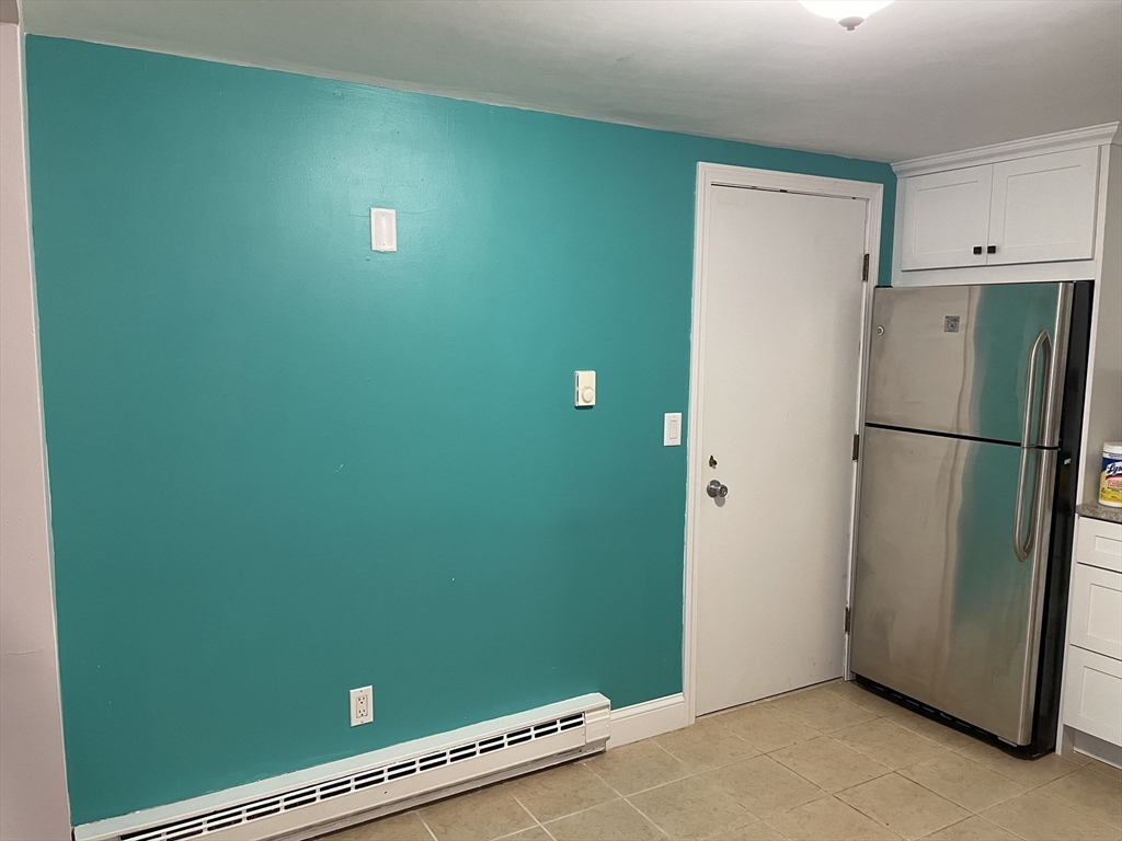 870 Haverhill Street, Unit 2B Rowley, MA 01969 - Photo 12 of 21 a view of kitchen with refrigerator and window