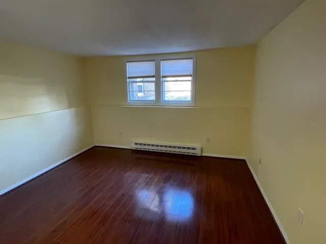 a view of front door with wooden floor