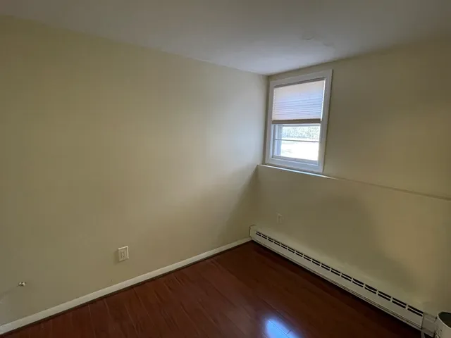 a bathroom with a shower a toilet and sink