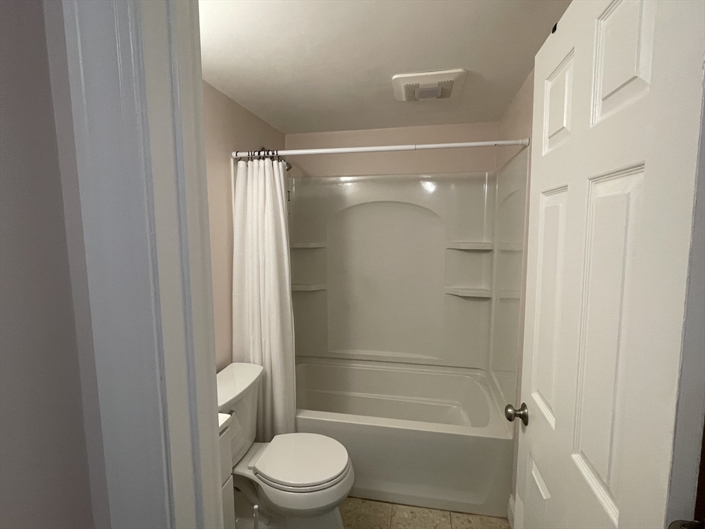 870 Haverhill Street, Unit 2B Rowley, MA 01969 - Photo 21 of 21 a bathroom with a shower a toilet and sink