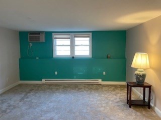 870 Haverhill Street, Unit 2B Rowley, MA 01969 - Photo 4 of 21 a room with green walls and a window