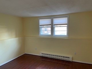 870 Haverhill Street, Unit 2B Rowley, MA 01969 - Photo 6 of 21 a view of a room with wooden floor and a window