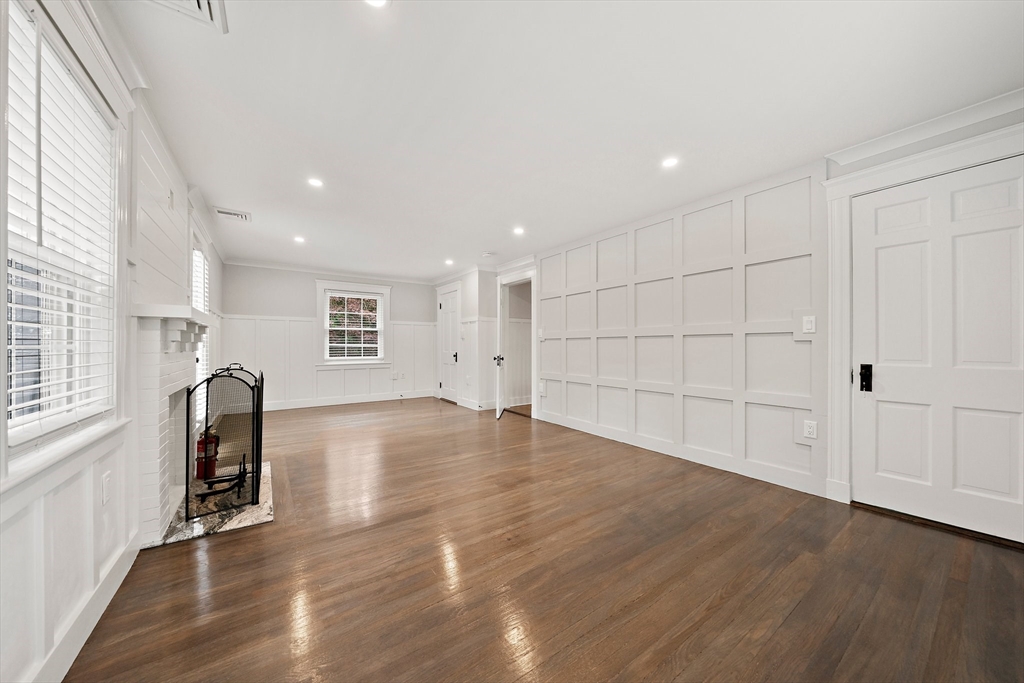 37 Wolcott Road, Unit 37 Brookline, MA 02467 - Photo 16 of 40 a view of empty room with wooden floor and fan