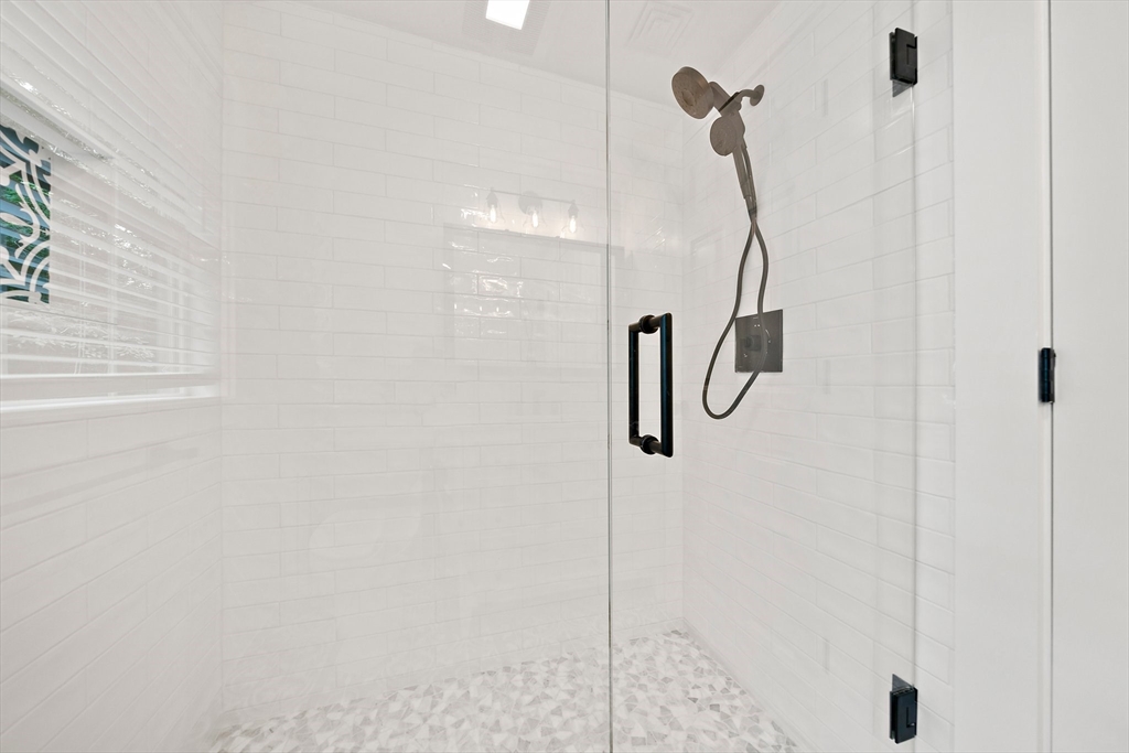 37 Wolcott Road, Unit 37 Brookline, MA 02467 - Photo 22 of 40 a bathroom with a shower