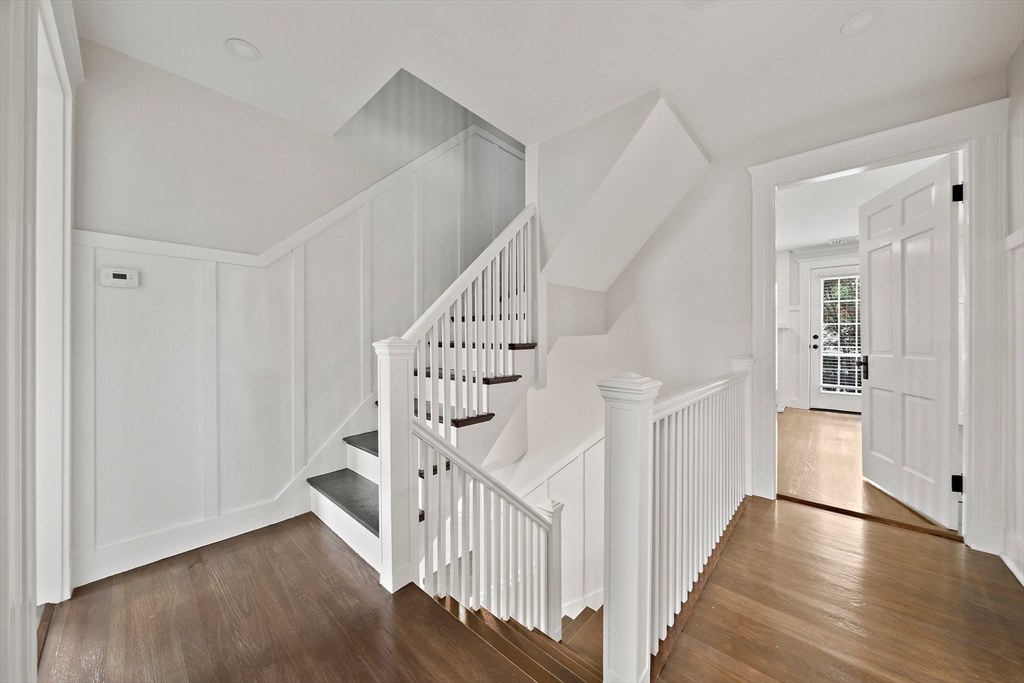 37 Wolcott Road, Unit 37 Brookline, MA 02467 - Photo 23 of 40 a view of a hallway with wooden floor and entryway