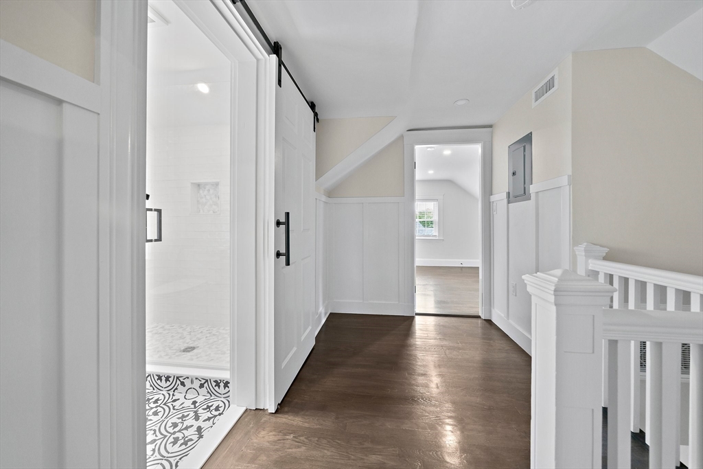 37 Wolcott Road, Unit 37 Brookline, MA 02467 - Photo 27 of 40 a view of an entryway with wooden floor