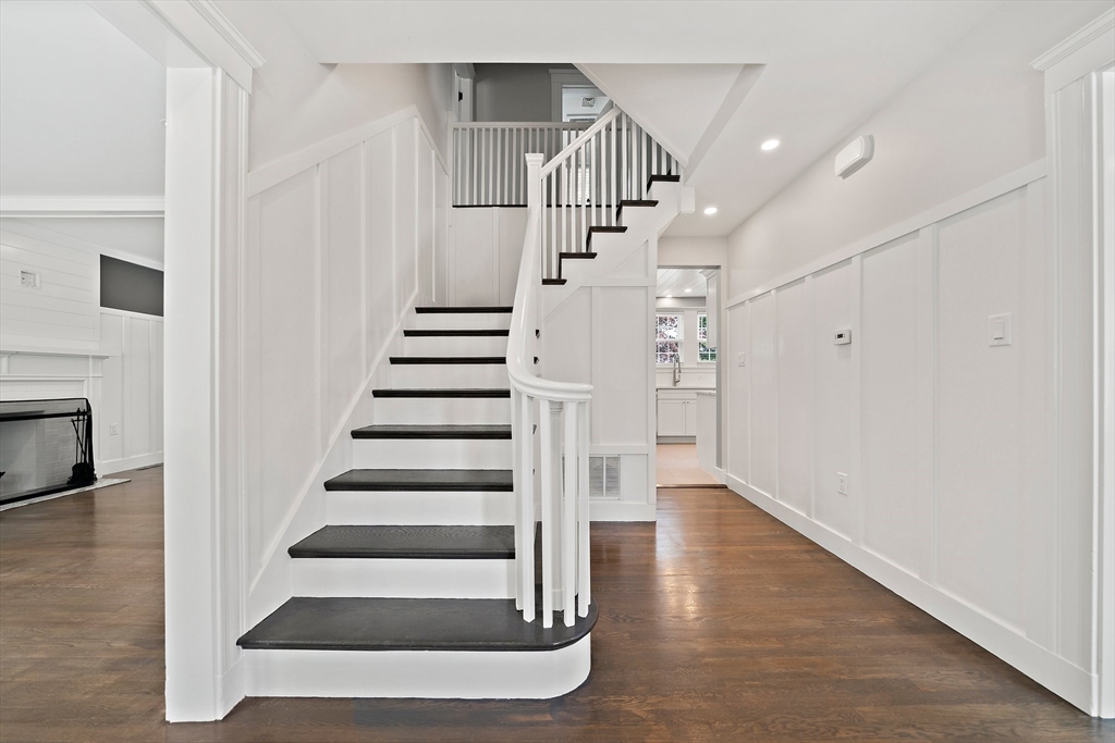 37 Wolcott Road, Unit 37 Brookline, MA 02467 - Photo 3 of 40 a view of entryway and hall with wooden floor