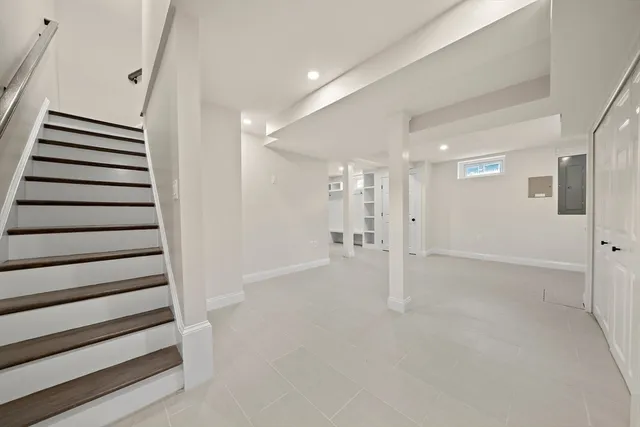a view of an empty room with stairs