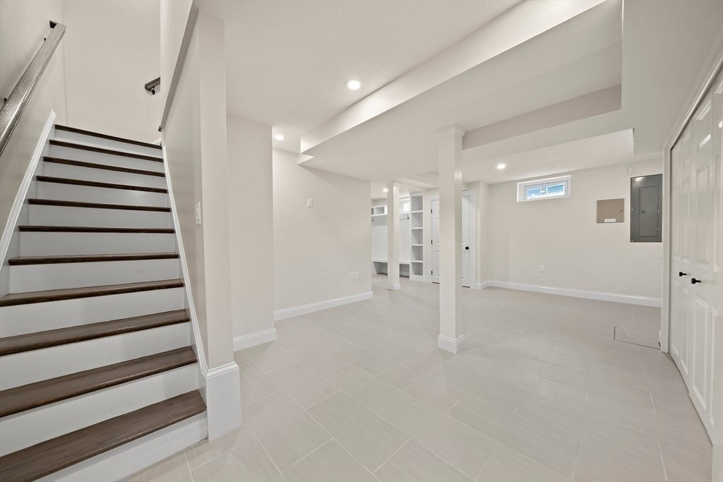 37 Wolcott Road, Unit 37 Brookline, MA 02467 - Photo 31 of 40 a view of an empty room with stairs