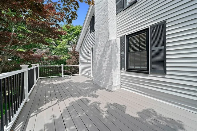 a view of backyard with a deck