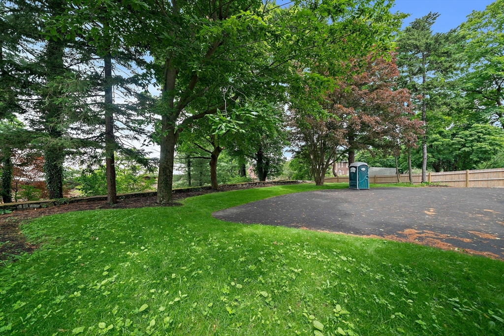 37 Wolcott Road, Unit 37 Brookline, MA 02467 - Photo 38 of 40 a view of green field with trees in the background