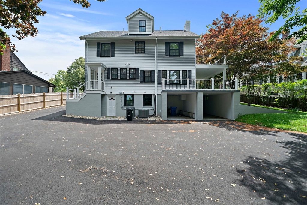 37 Wolcott Road, Unit 37 Brookline, MA 02467 - Photo 39 of 40 a front view of a house with a yard