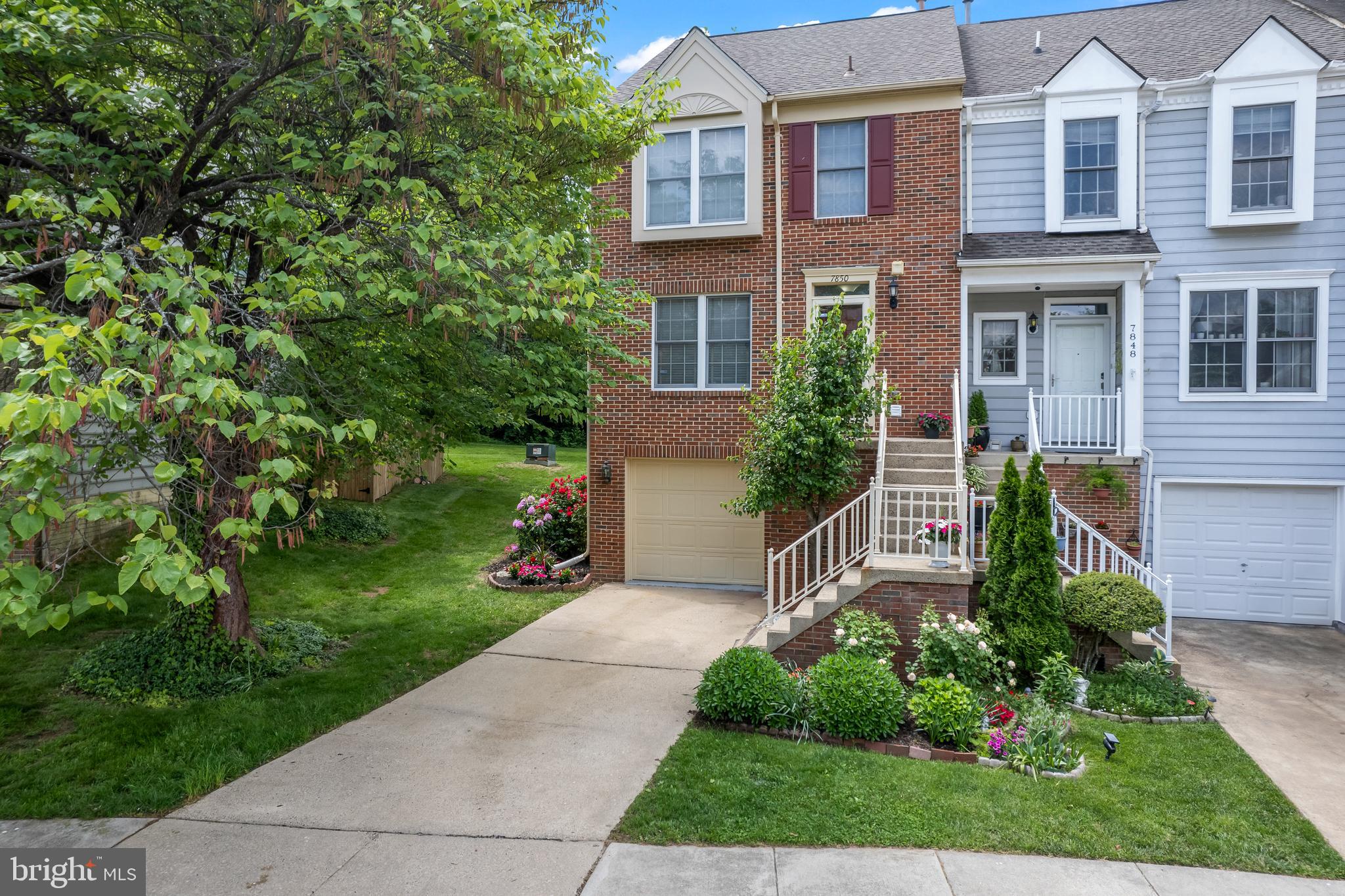 front view of a house with a yard