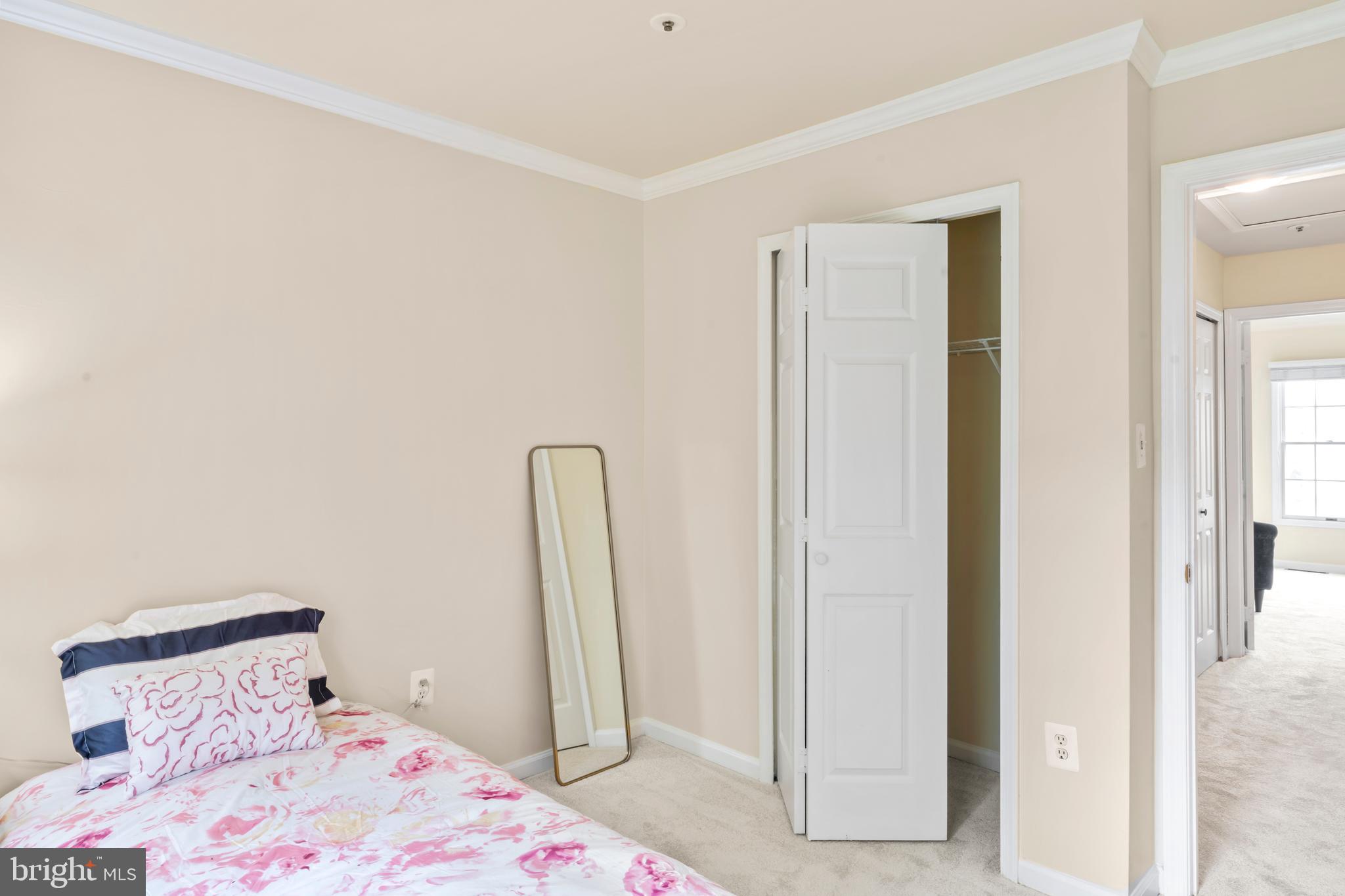 7850 Blue Gray Circle Manassas, VA 20109 - Photo 21 of 42 a bedroom with a bed and wooden floor