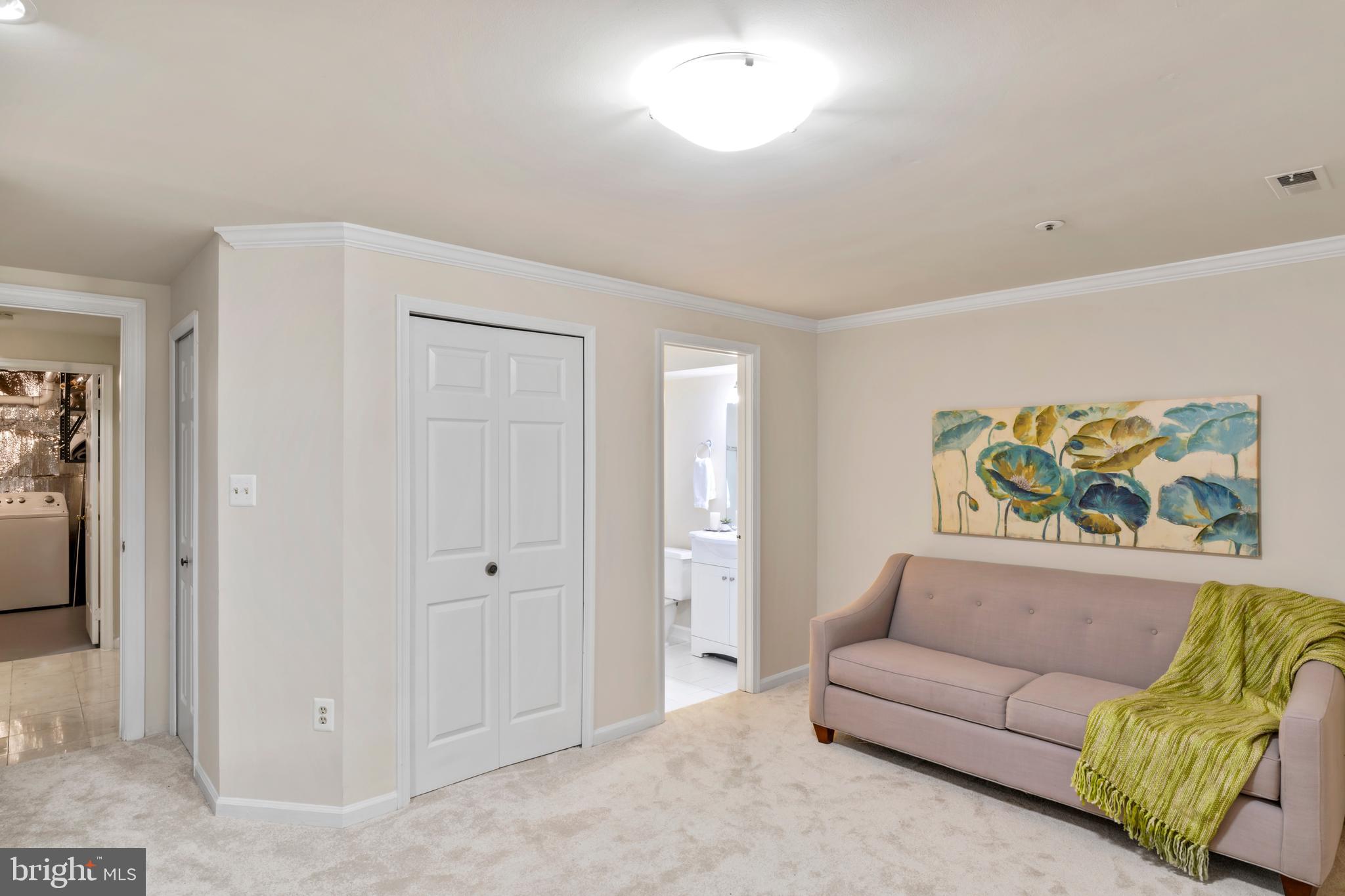 7850 Blue Gray Circle Manassas, VA 20109 - Photo 28 of 42 a living room with furniture and a painting on the wall