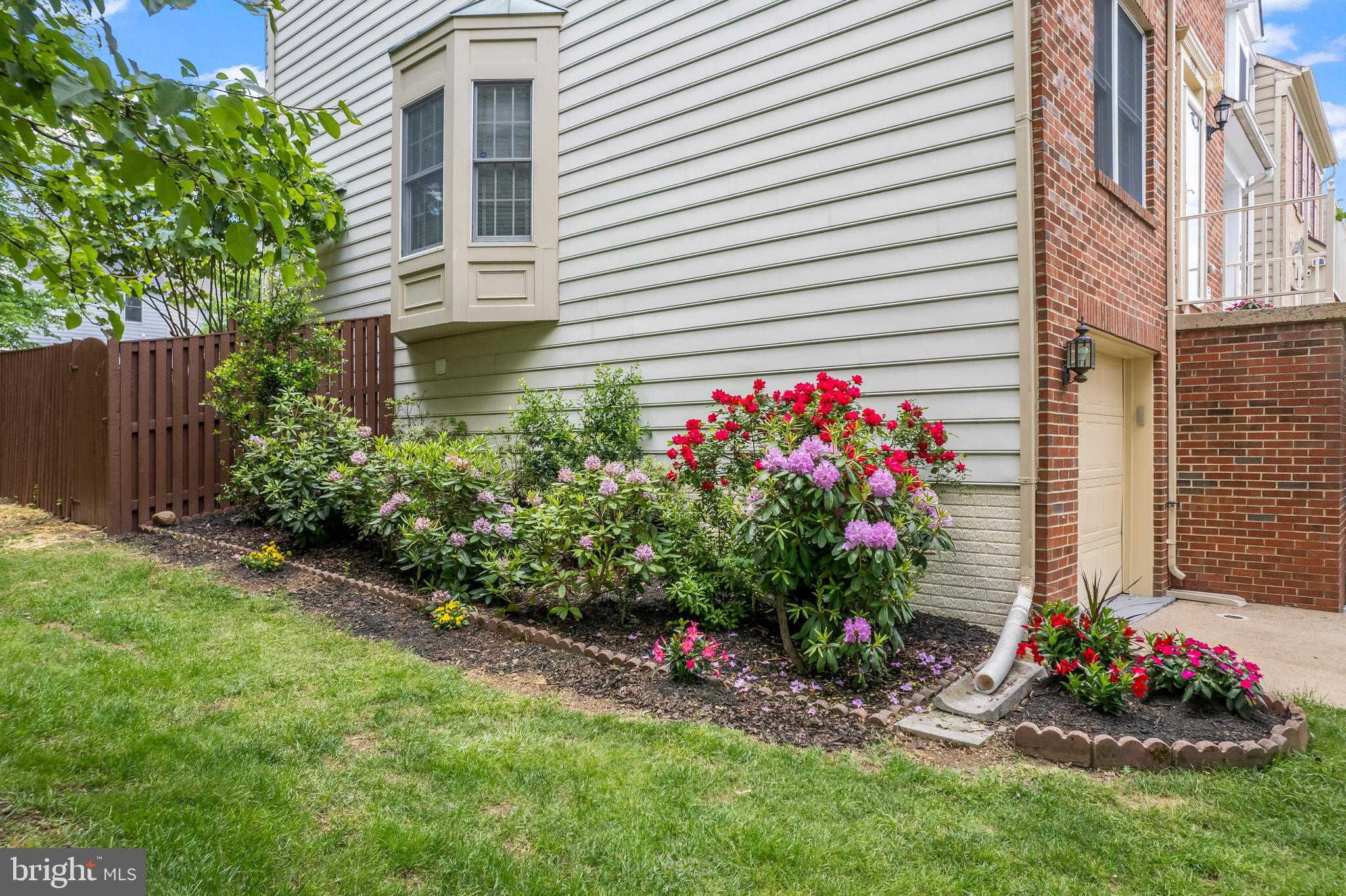 7850 Blue Gray Circle Manassas, VA 20109 - Photo 33 of 42 a view of a potted plant sitting in front of a house