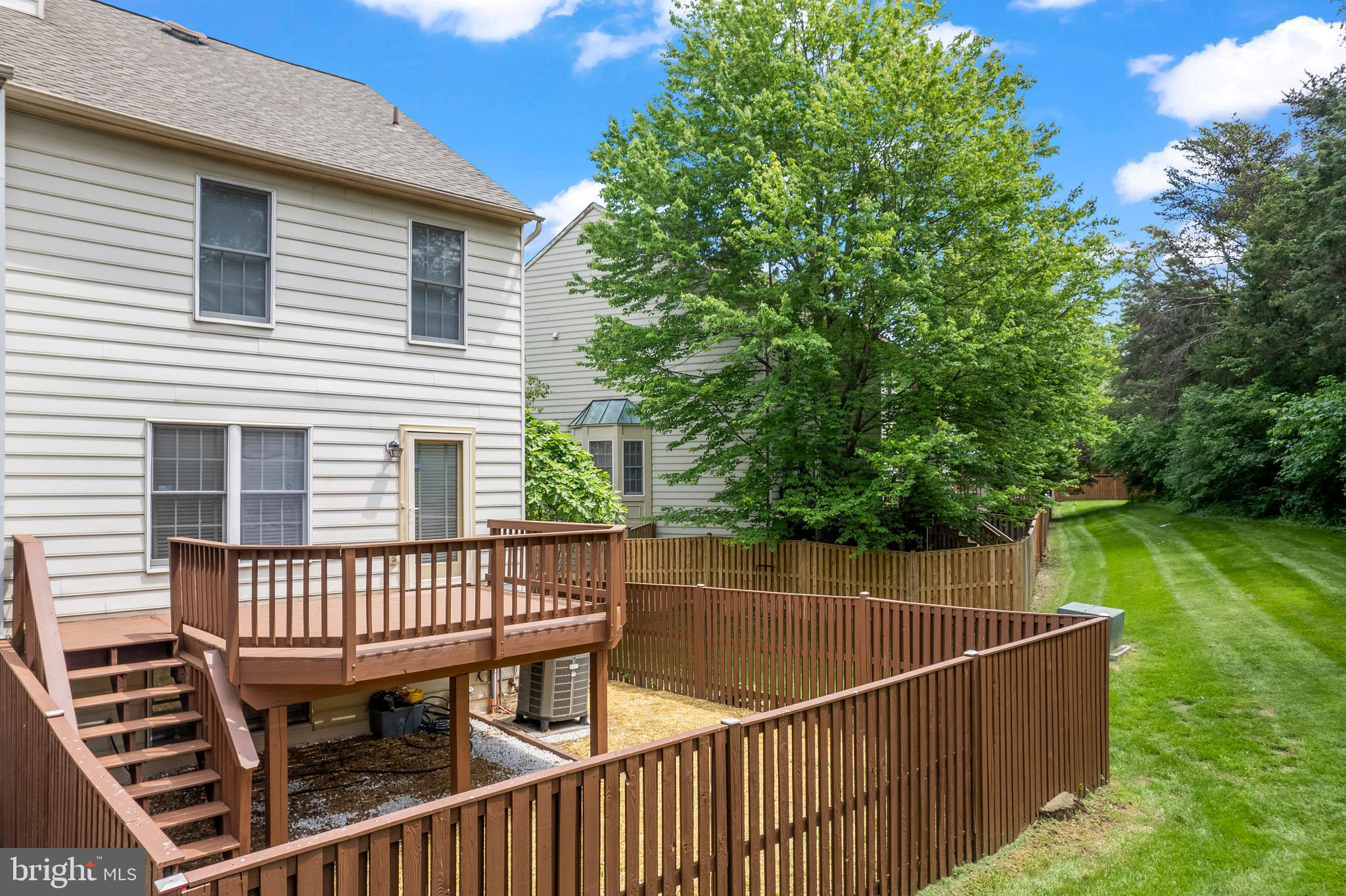 7850 Blue Gray Circle Manassas, VA 20109 - Photo 34 of 42 a view of a roof deck with chair and wooden floor