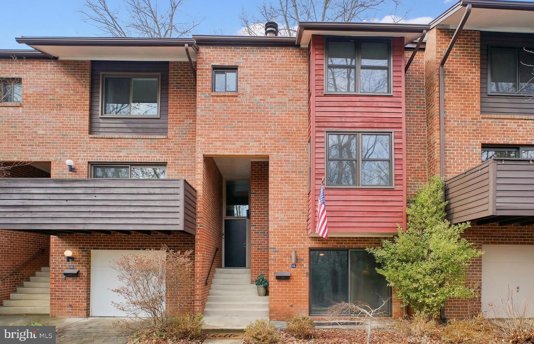 a view of a house with a door and wooden floor