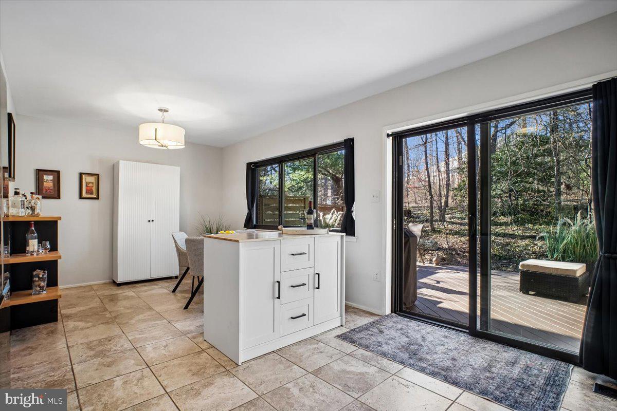 11514 Sunder Court Reston, VA 20190 - Photo 18 of 81 a room with a large window and walk in closet with wooden floor