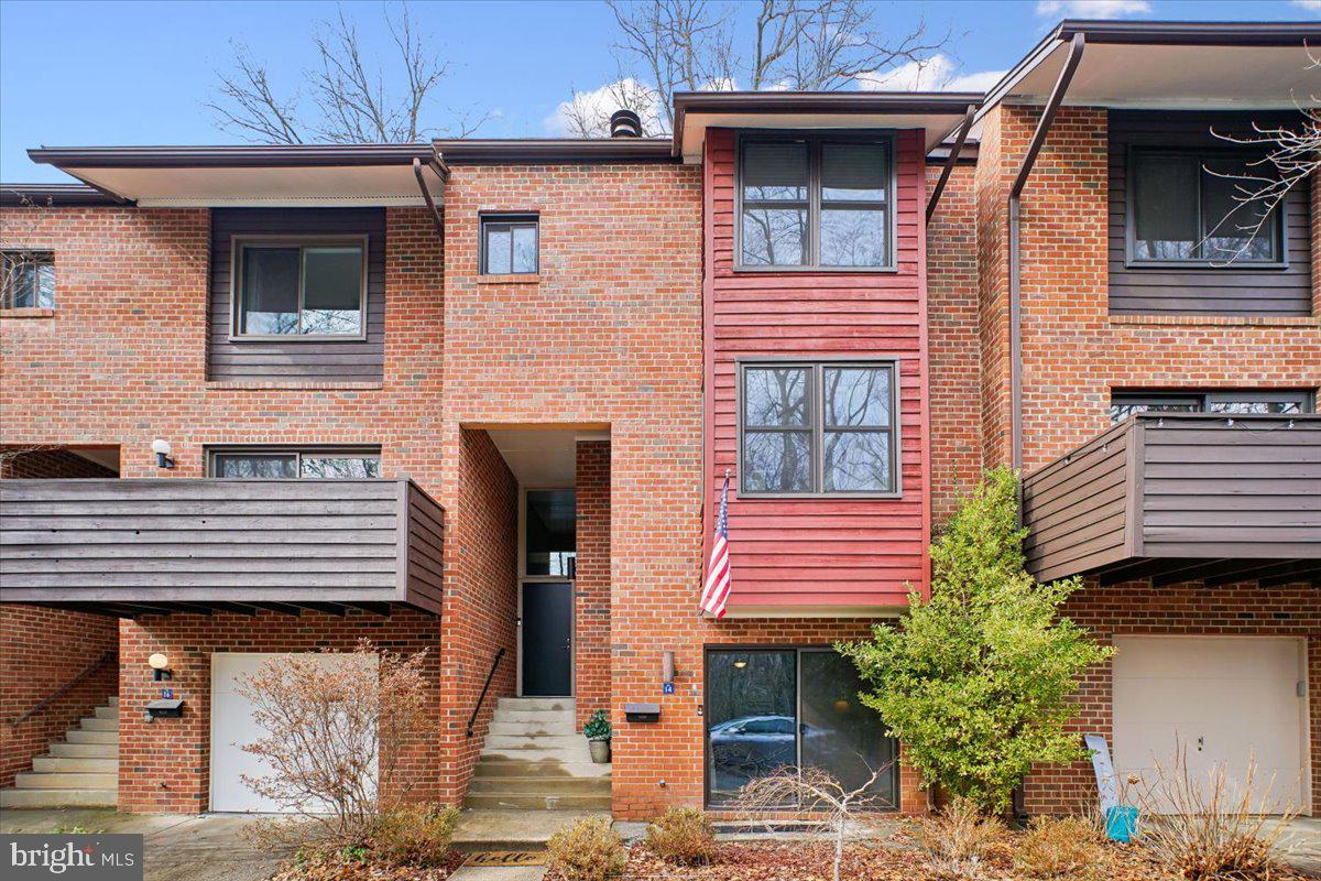 11514 Sunder Court Reston, VA 20190 - Photo 2 of 81 a front view of a house with a balcony