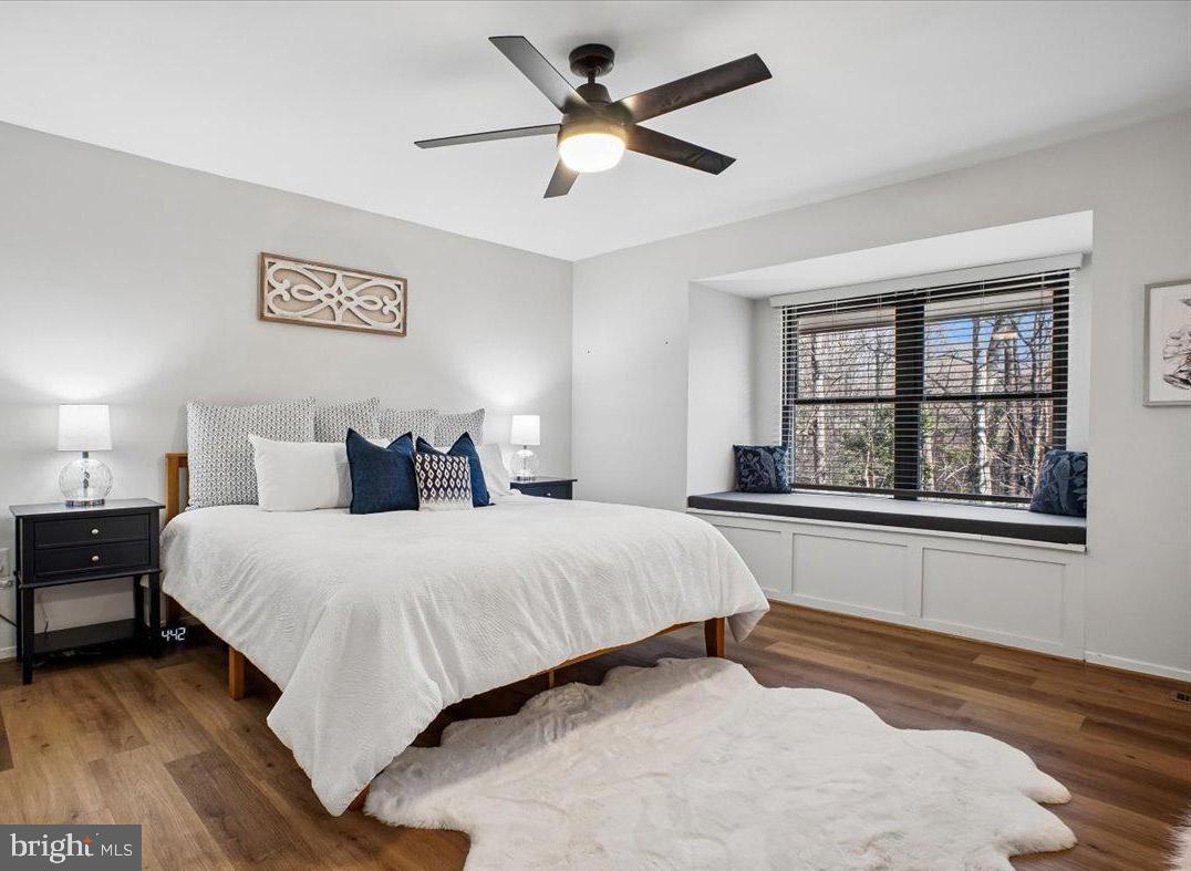 11514 Sunder Court Reston, VA 20190 - Photo 22 of 81 a spacious bedroom with a bed and a window