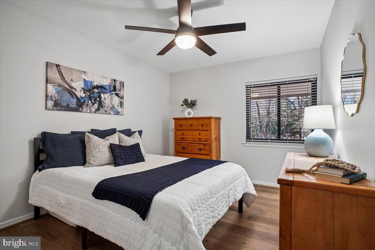 11514 Sunder Court Reston, VA 20190 - Photo 29 of 81 a bedroom with a bed and wooden floor