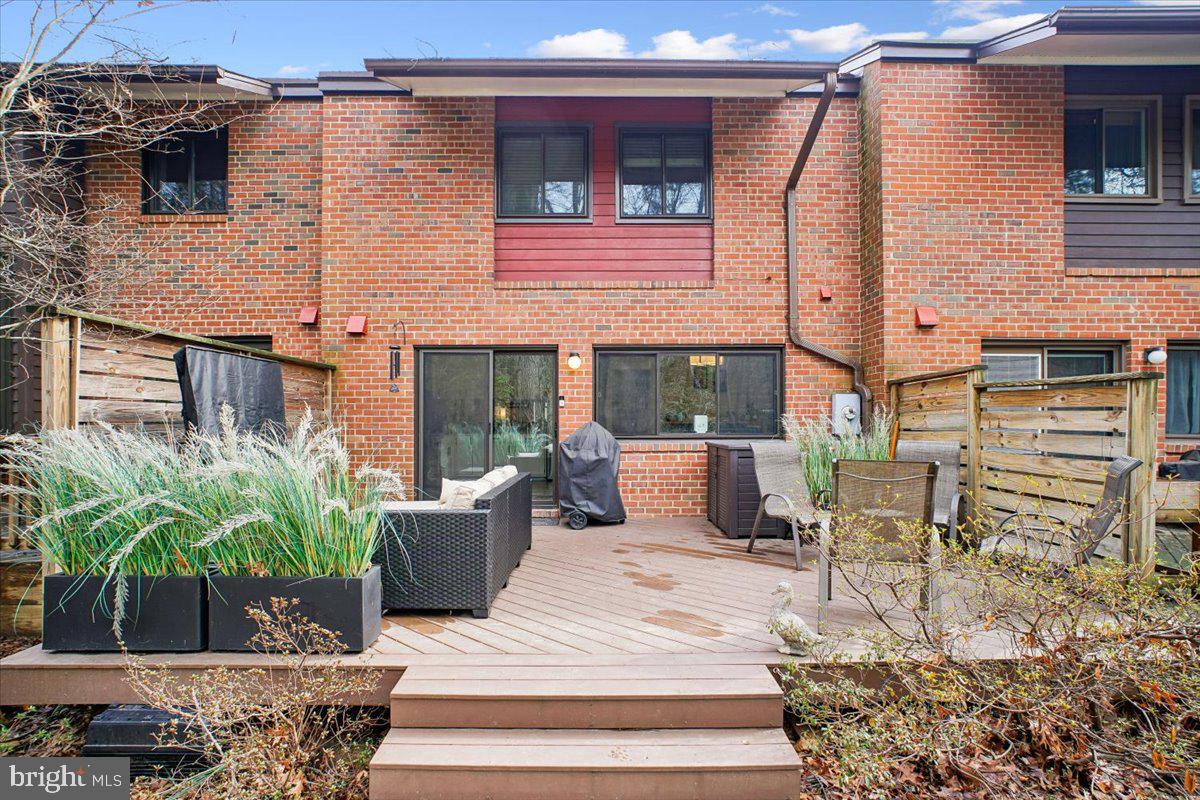 11514 Sunder Court Reston, VA 20190 - Photo 3 of 81 a view of a patio with couches table and chairs and potted plants