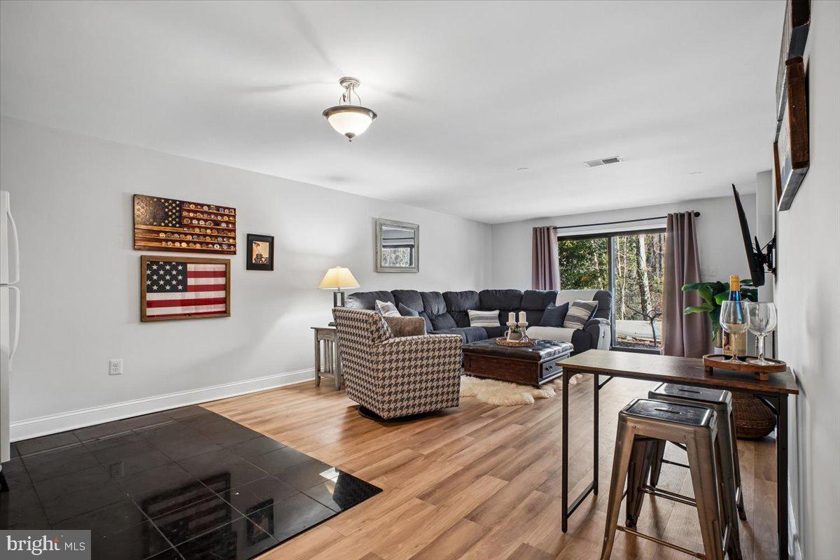 11514 Sunder Court Reston, VA 20190 - Photo 35 of 81 a living room with furniture and wooden floor