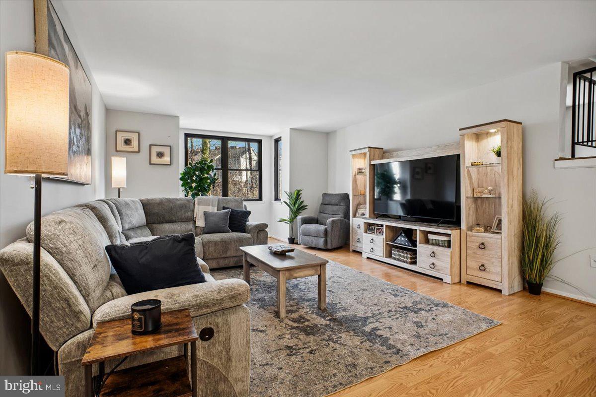 11514 Sunder Court Reston, VA 20190 - Photo 6 of 81 a living room with furniture and a flat screen tv