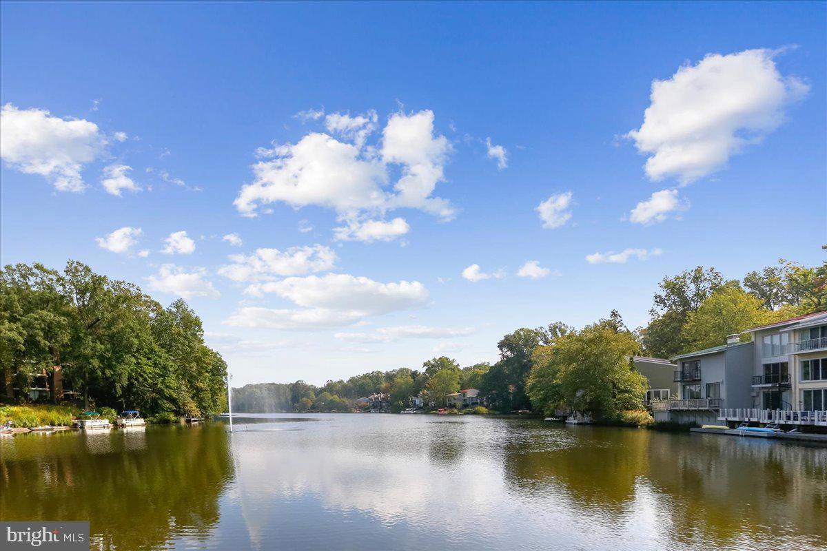 11514 Sunder Court Reston, VA 20190 - Photo 60 of 81 a view of a lake with houses in the background