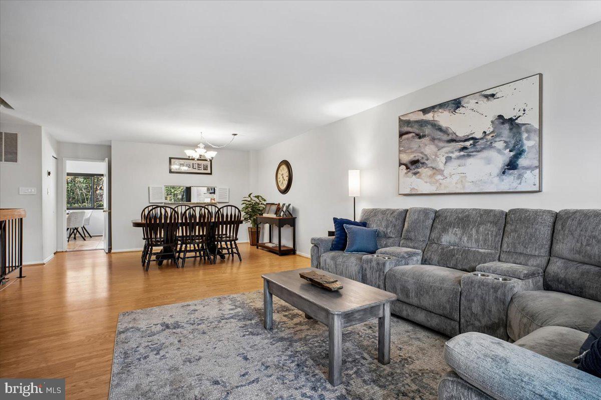 11514 Sunder Court Reston, VA 20190 - Photo 7 of 81 a living room with furniture and wooden floor