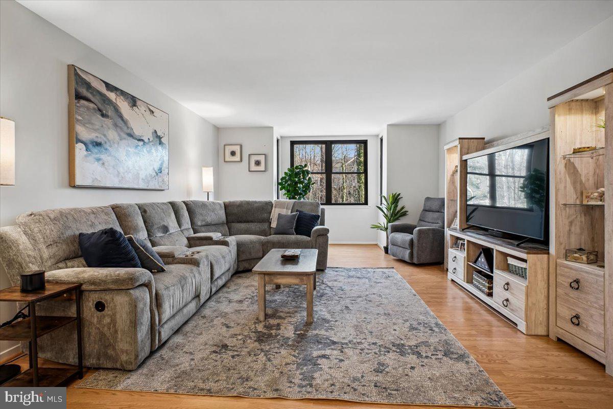 11514 Sunder Court Reston, VA 20190 - Photo 8 of 81 a living room with furniture and a flat screen tv