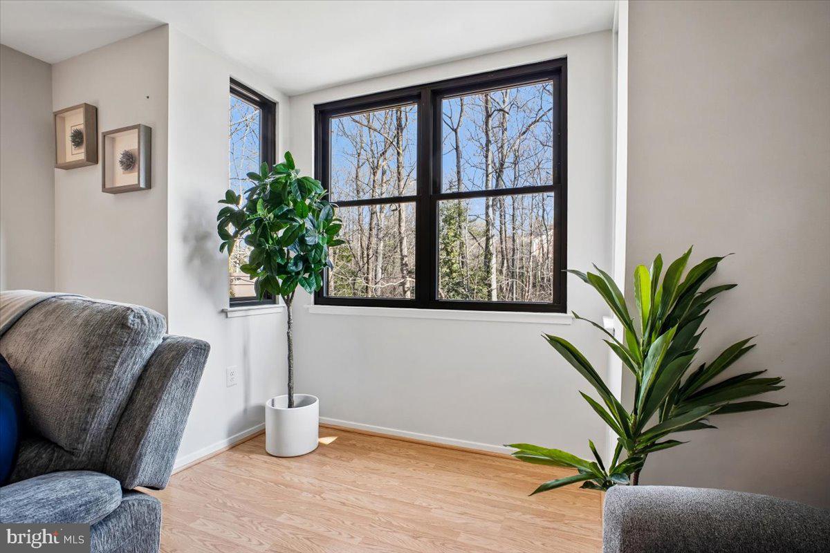 11514 Sunder Court Reston, VA 20190 - Photo 9 of 81 a living room with furniture potted plant and a window