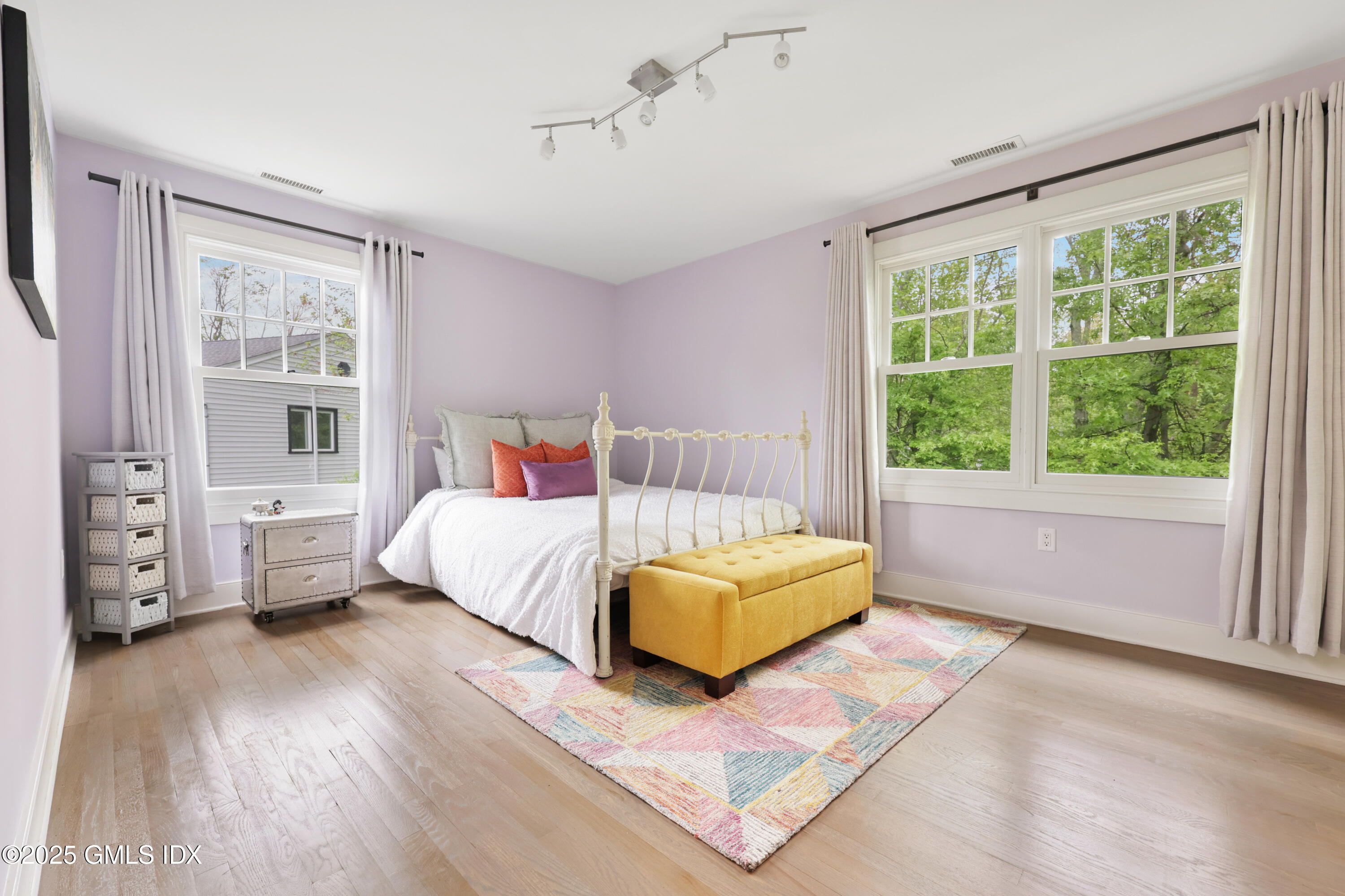 29 Griffith Road Riverside, CT 06878 - Photo 13 of 25 a bedroom with a bed and a large window