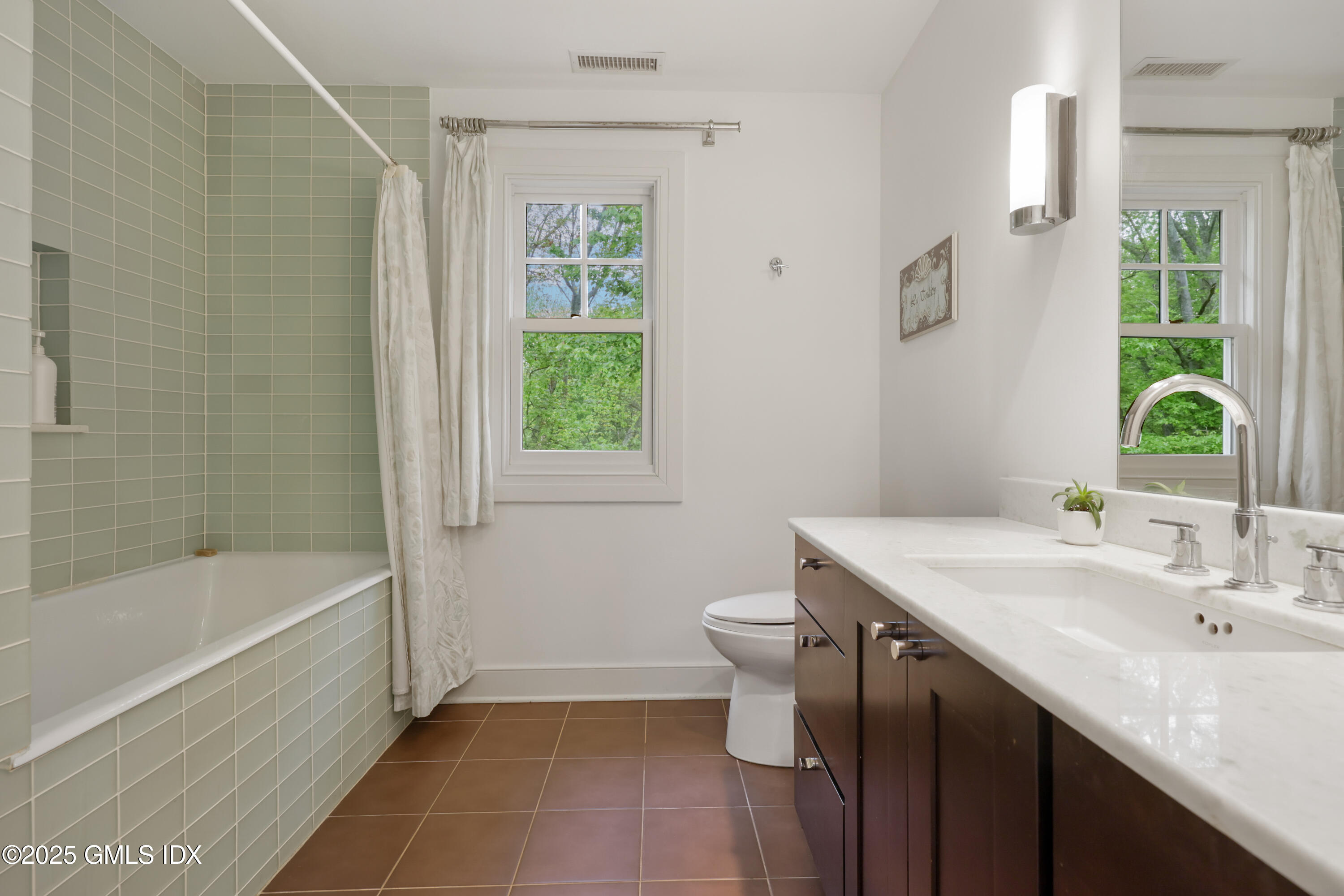 29 Griffith Road Riverside, CT 06878 - Photo 16 of 25 a bathroom with a sink and a bathtub