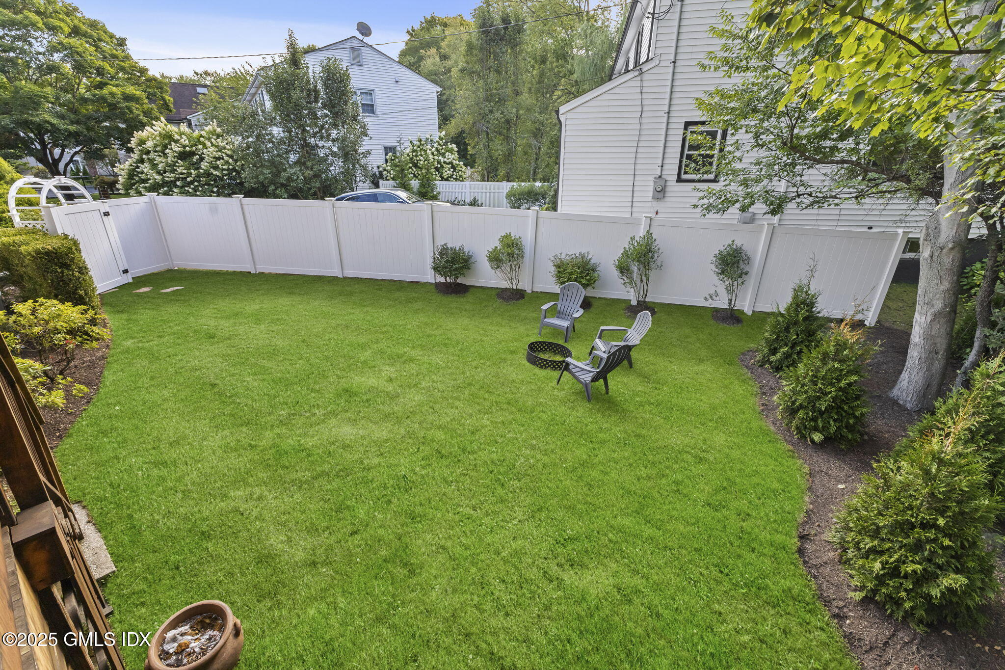 29 Griffith Road Riverside, CT 06878 - Photo 2 of 25 a view of a backyard with couches plants and large trees