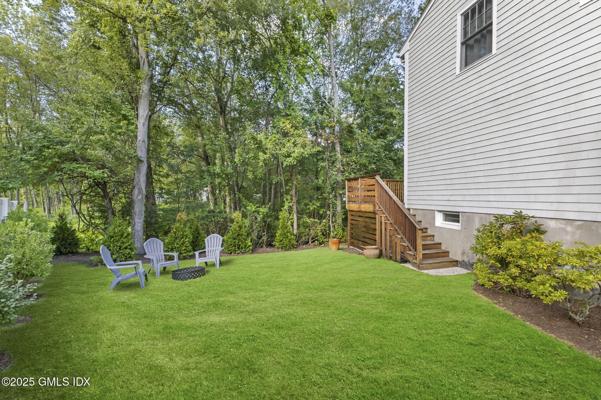 29 Griffith Road Riverside, CT 06878 - Photo 21 of 25 a view of a house with backyard sitting area and garden