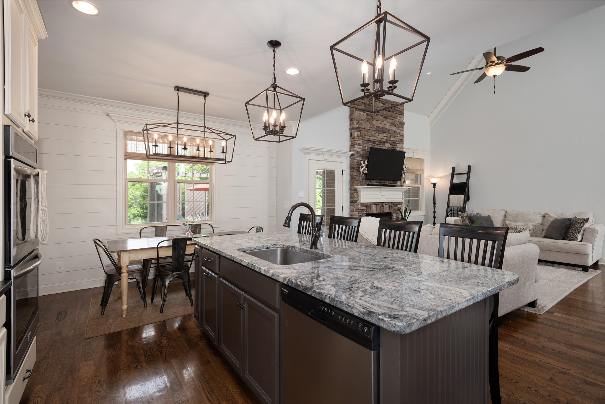 209 Ridgeview Preserve Drive Mount Juliet, TN 37122 - Photo 11 of 46 a kitchen with center island table chairs in it and wooden floor