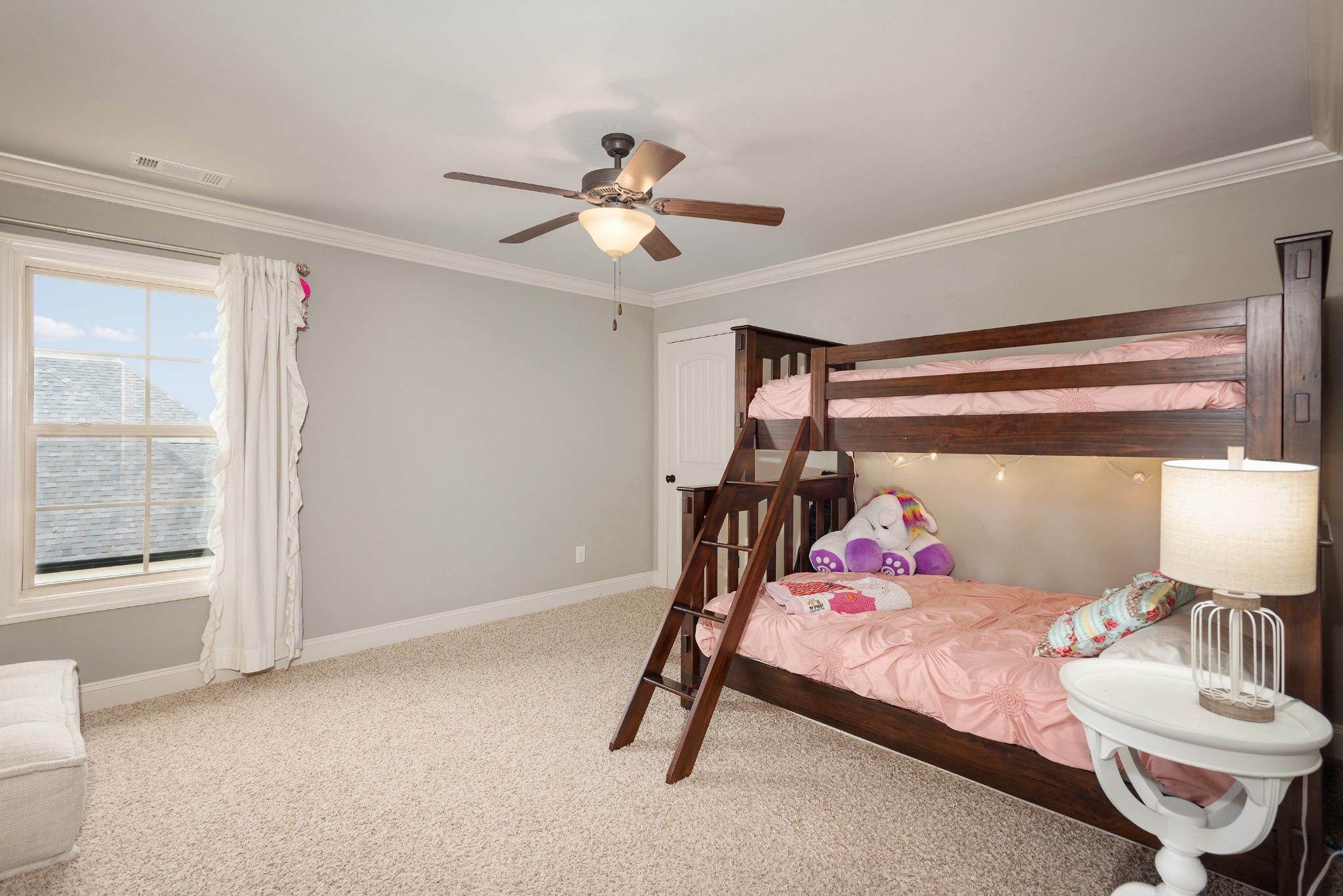 209 Ridgeview Preserve Drive Mount Juliet, TN 37122 - Photo 23 of 46 a bedroom with a bed and a chandelier