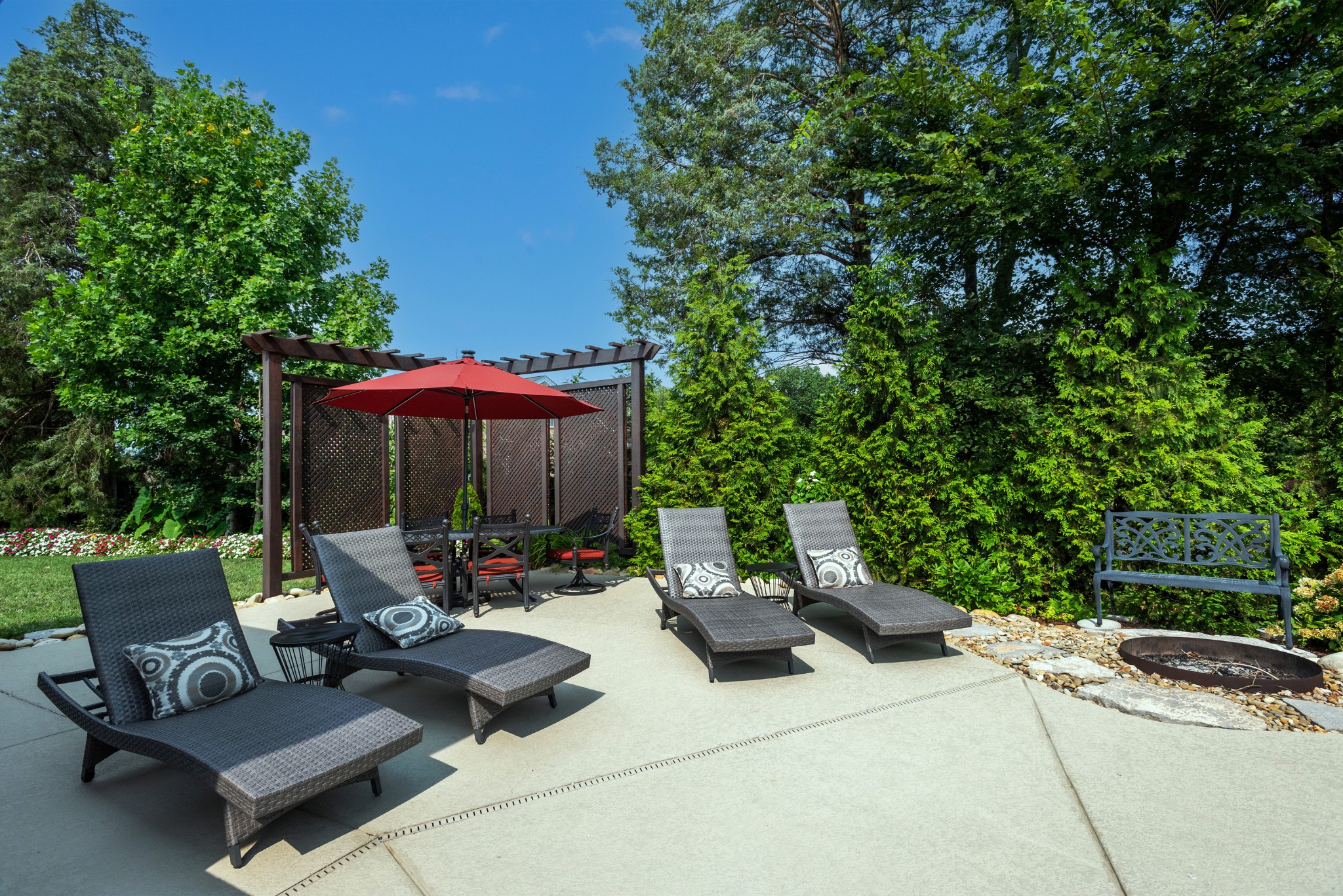 209 Ridgeview Preserve Drive Mount Juliet, TN 37122 - Photo 32 of 46 a view of a patio with a table and chairs under an umbrella