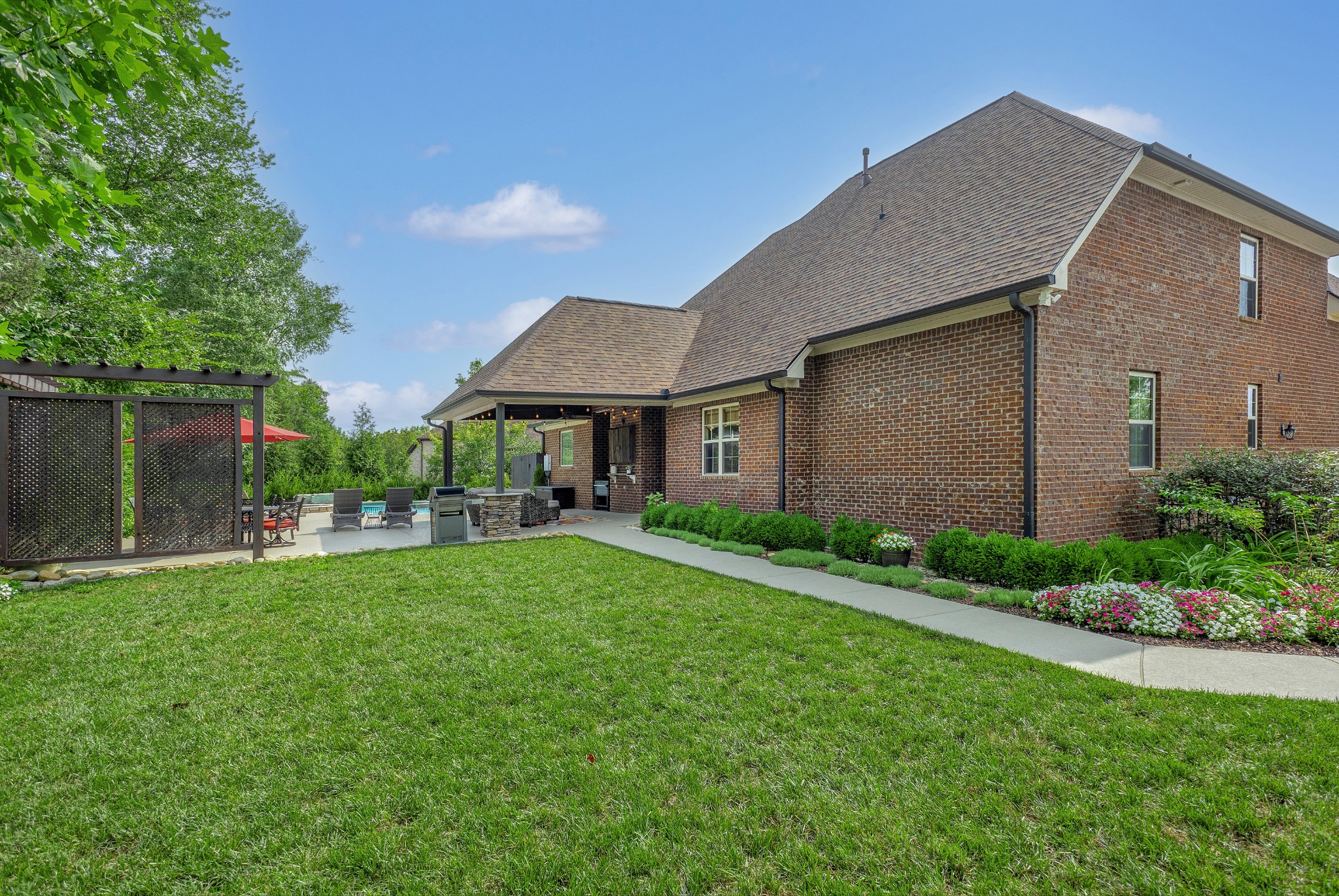 209 Ridgeview Preserve Drive Mount Juliet, TN 37122 - Photo 34 of 46 a front view of a house with a yard and table and chairs